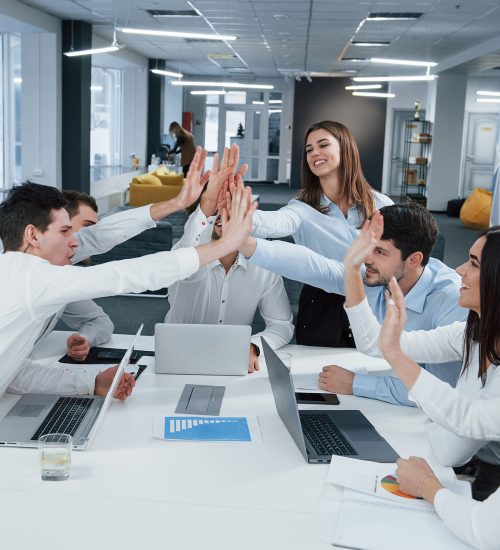 Cheerful business people. Job is done. Group of office workers happy to hit their own records and being successful.